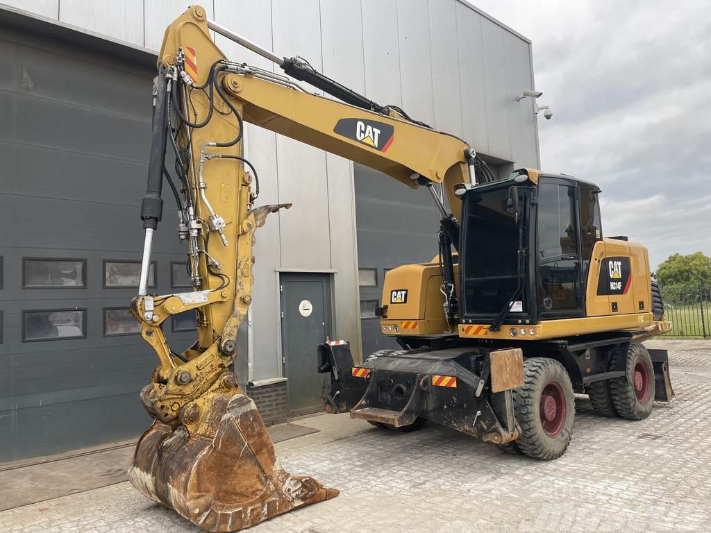CAT M314F with Outriggers Wheeled excavators