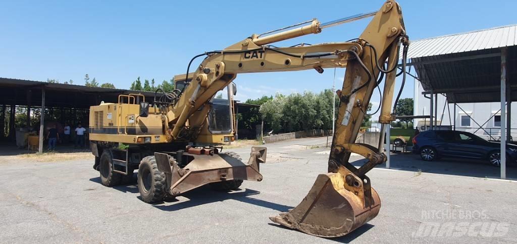 CAT 214 B Εκσκαφείς με τροχούς - λάστιχα
