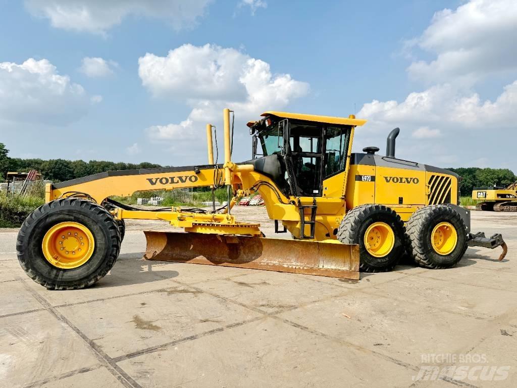 Volvo G970 + RIPPER Γκρέιντερς