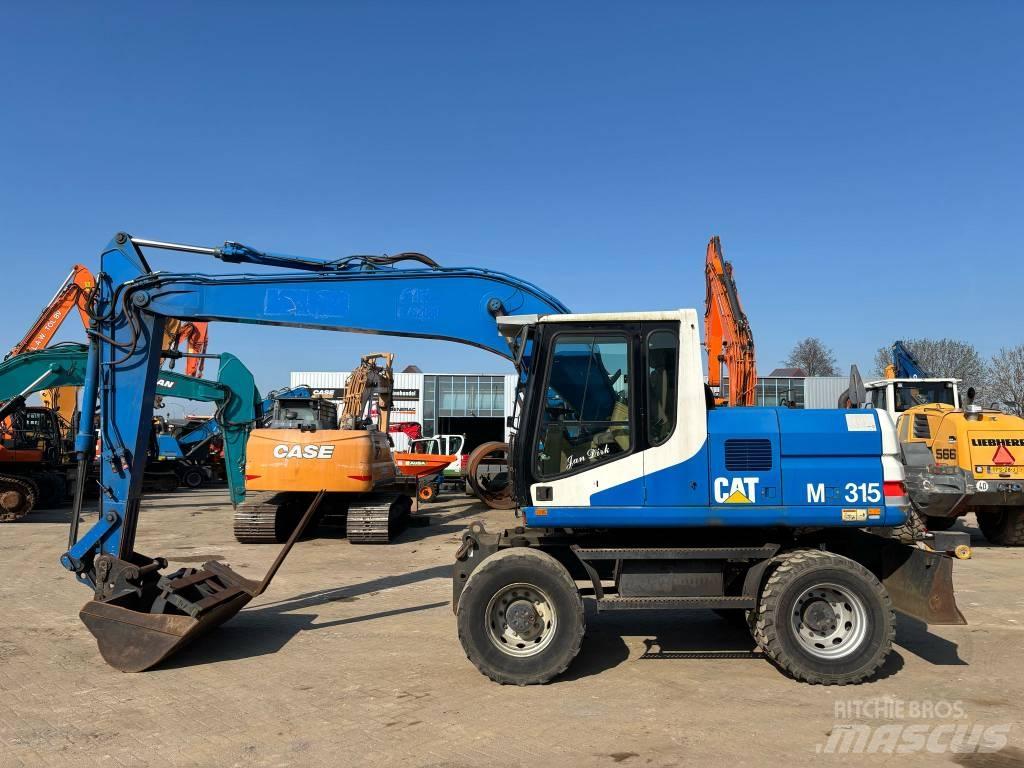 CAT M 315 Εκσκαφείς με τροχούς - λάστιχα