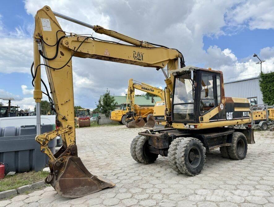 CAT M318 Εκσκαφείς με τροχούς - λάστιχα