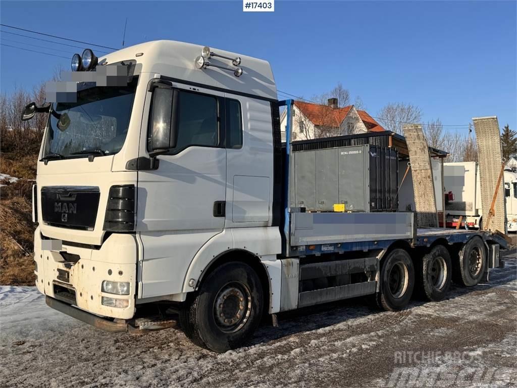 MAN TGX 35.480 8x4 flatbed truck w/ driving bridges Φορτηγά Kαρότσα με ανοιγόμενα πλαϊνά